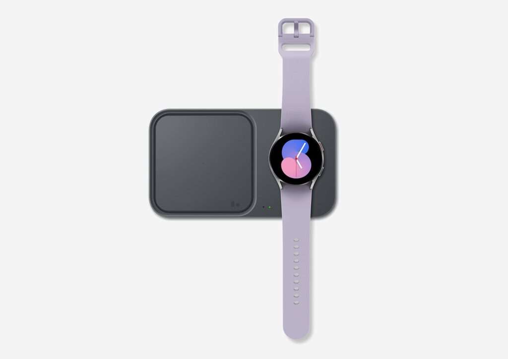 Smartwatch charging - A smartwatch connected to its charger, ensuring efficient power replenishment for uninterrupted usage.